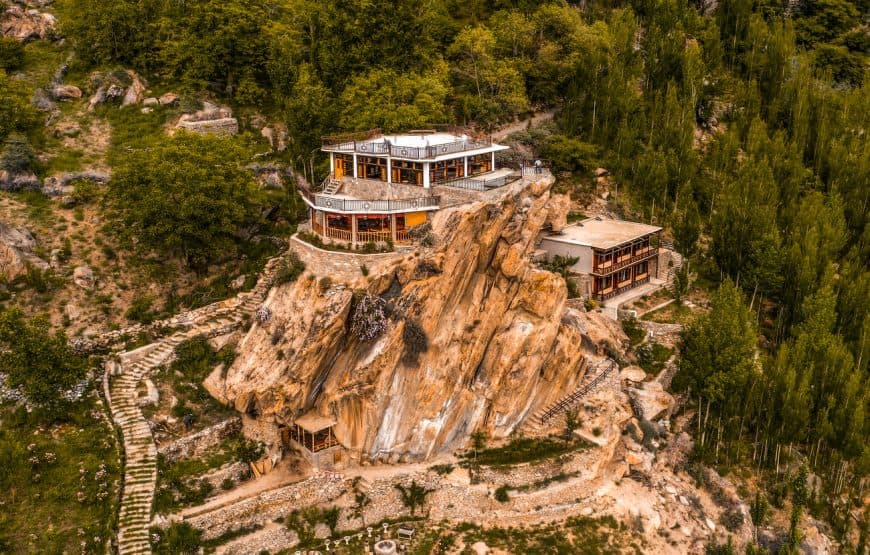 Aerial view of the Offsite.Living property built into a mountain cliff